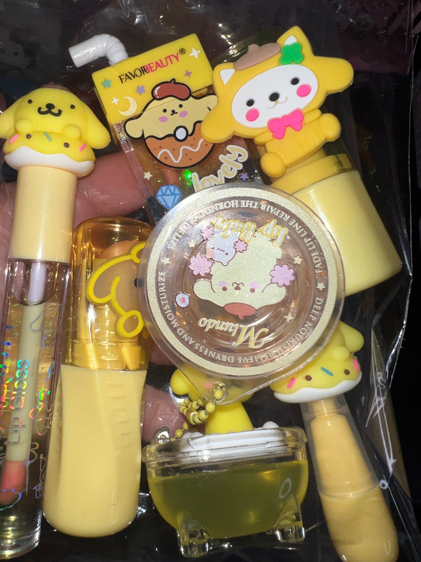 A Hello Kitti, Kuku, Melo, Cina and More lipgloss and accessories pre-pack bundles