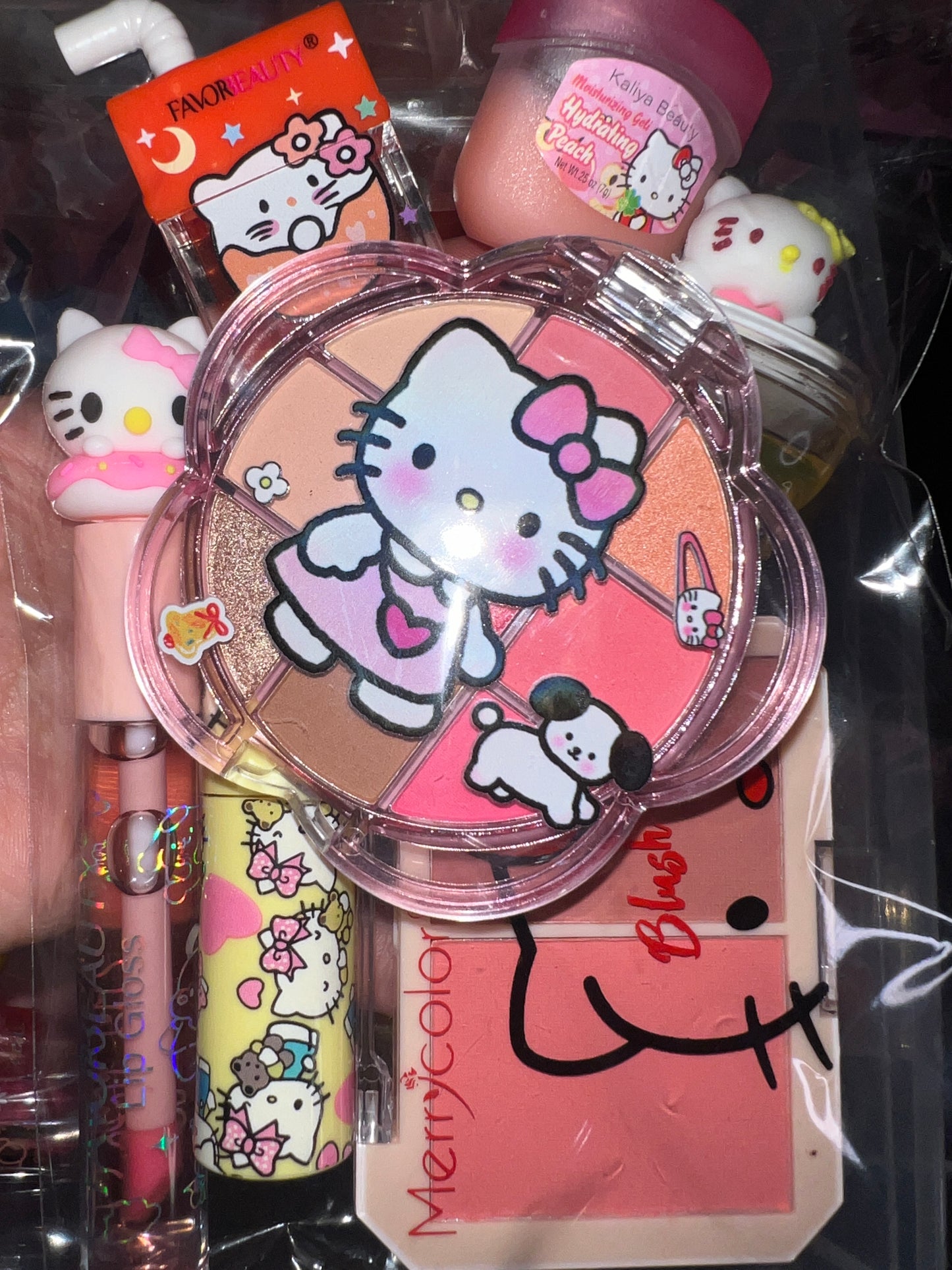 A Hello Kitti, Kuku, Melo, Cina and More lipgloss and accessories pre-pack bundles