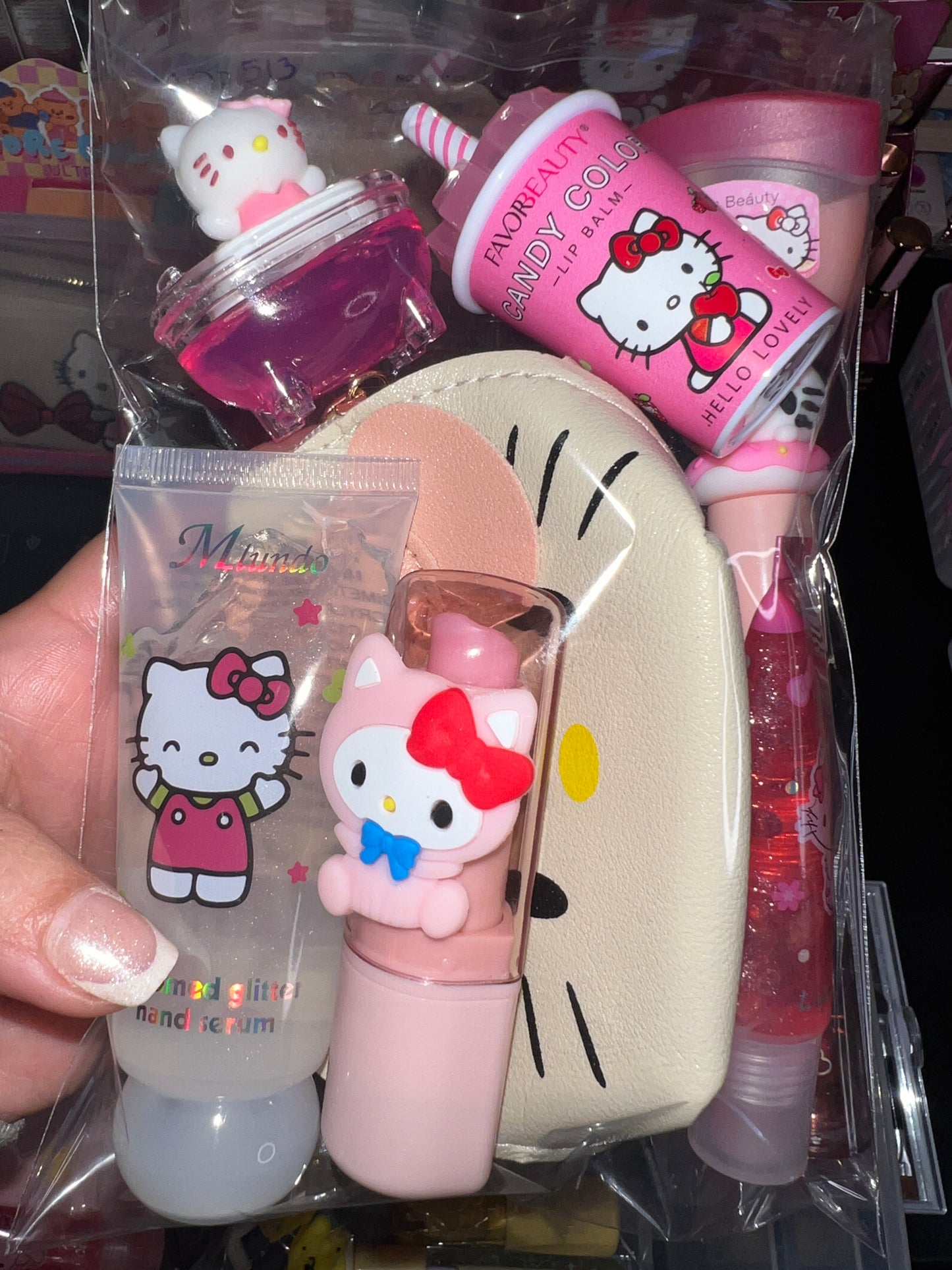 A Hello Kitti, Kuku, Melo, Cina and More lipgloss and accessories pre-pack bundles